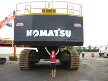 Jen at the Ritchie Sale in Queensland under a large excavator