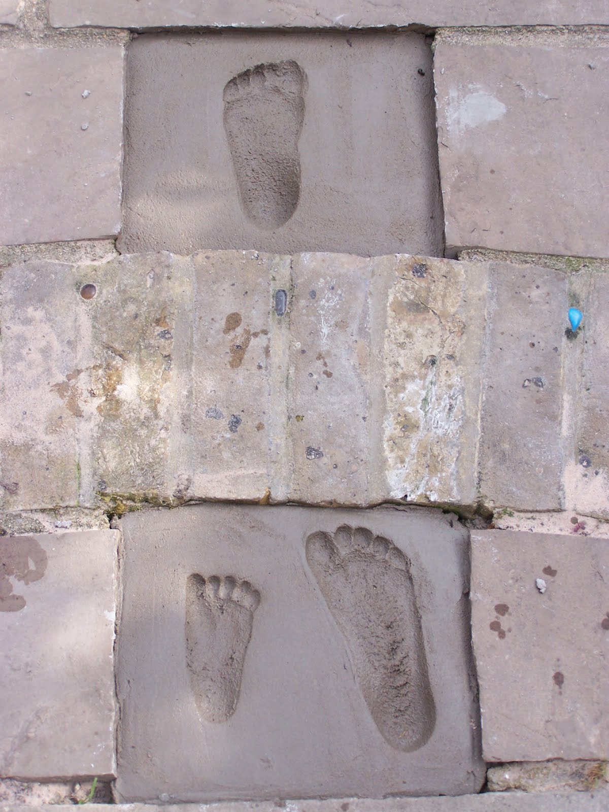 Glittering Shards | Make mosaic cement foot prints and hand prints