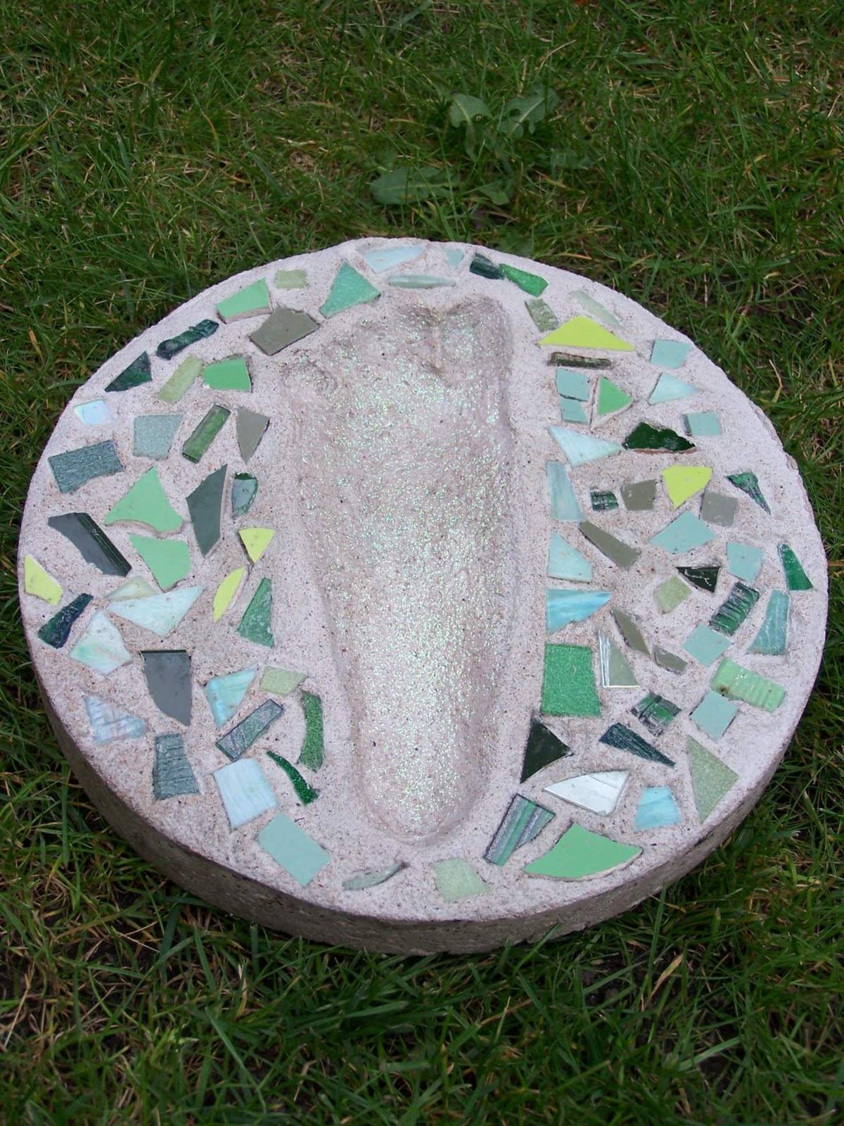Glittering Shards Make mosaic cement foot prints and hand prints