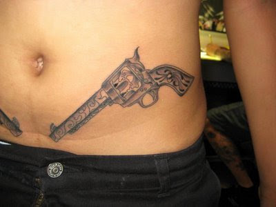 For this week's Tattoo Tuesday we came across this tattoo of a gun For this week's Tattoo Tuesday we came across this tattoo of a gun