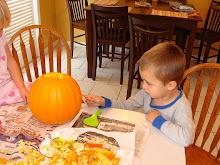 Kyler carving his pumpkin