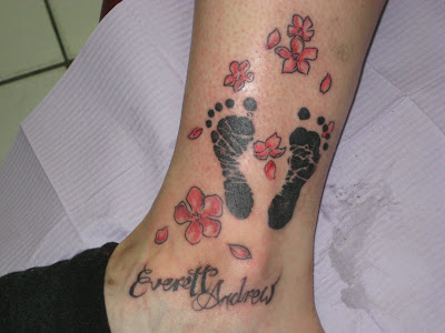 A friend of mine had his baby's footprint tattooed on his shoulder blade two A friend of mine had his baby's footprint tattooed on his shoulder blade two