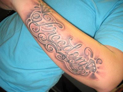 forearm tattoos. name tattoos on forearm.