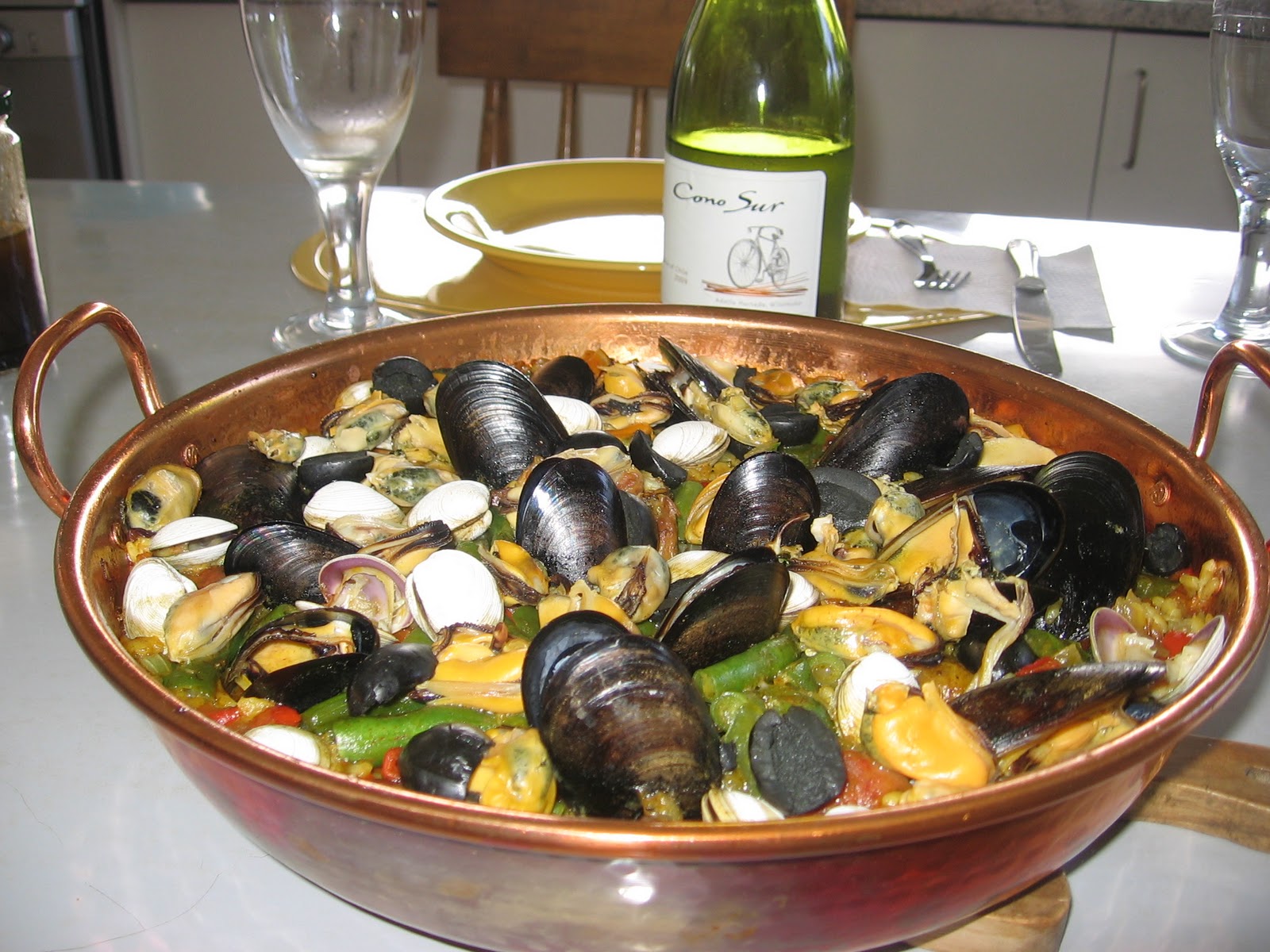 Paella within an unlined copper pan