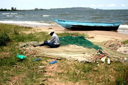 Man repairing fishing nets