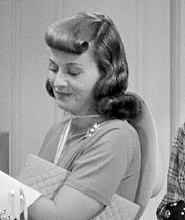 This hairstyle is worn by Paulette Goddard for the character of Miriam 