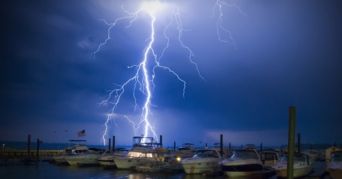 Noesises Stunning Blue Lightning Strike Splits Sky Over Yachts