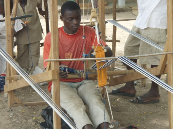 A weaver working at his loom