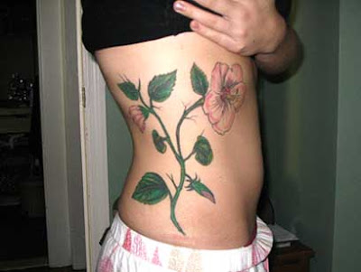 tropical flower tattoo. 63 · purple flower tattoos