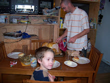 spencer and daddy on at the table on thanksgiving day