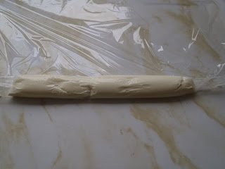 Mozzatura: rolling the mozzarella into a log to make bocconcini