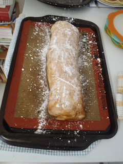 The strudel, after baking, dusted with icing sugar