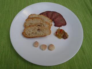 An Edmonton tasting plate: buffalo tongue, toast, marrow, grainy mustard, and homemade relish