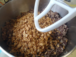 Mixing the forcemeat with toasted oats