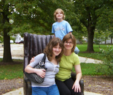 me and the kids in the tallest man in the world's chair replica