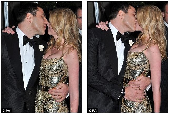 David Walliams gives his laydee Lara Stone a kiss as they ...
