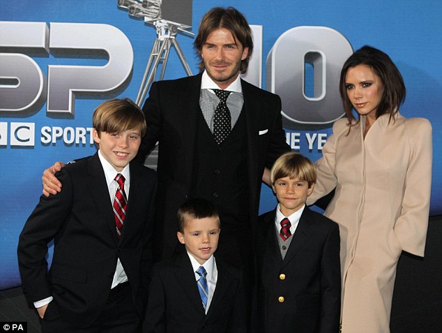Expecting: David and Victoria Beckham with sons Brooklyn, Cruz and Romeo at 
