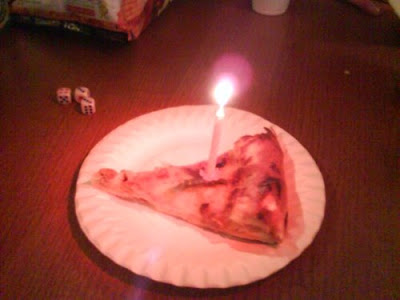 cold pizza with candle