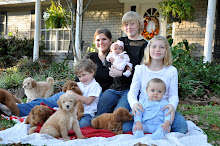 Becky with kids and puppies everywhere! 2010