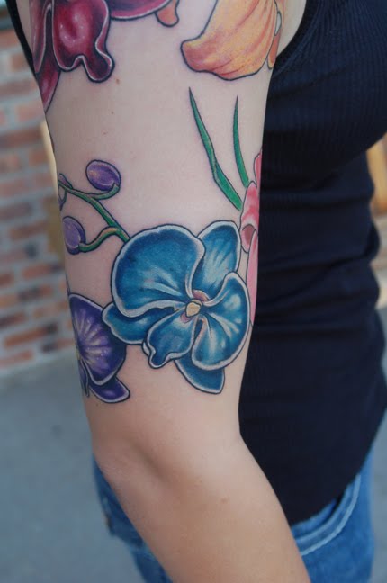 Orchid tattoo can be designed to be small and delicate or big and bold.