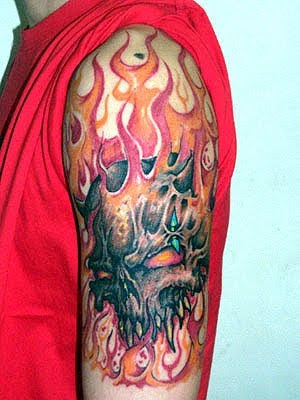 skull tattoo arm. Red skull tattoo on arm
