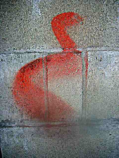red squiggle someone cleaning their brush on a wall