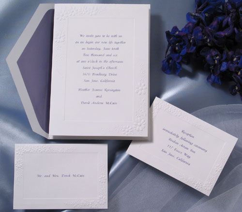 This sweet embossed bright white daisy invitation works well with any ink or