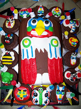 Totem Pole Cake with totem cupcakes