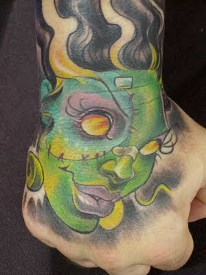Close-up Face Tattoo on Hand