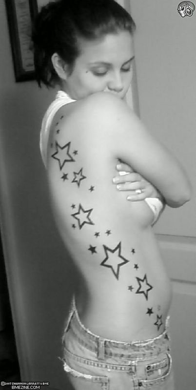 Amazing Female Side Body Star Tribal Tattoos Picture 1