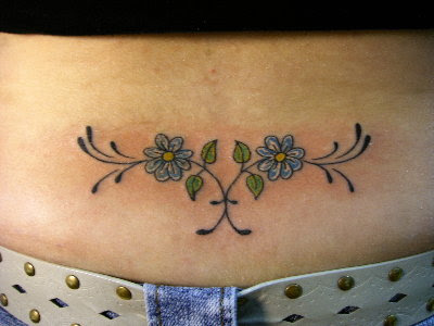 unique lower back Flower tattoos are the perfect design for the sexy girl.