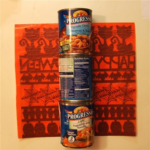 [soup+cans+as+base+to+fasten+edge+tape.jpg]