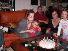 Blowing up the candles with Mommy