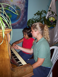Teaching piano to Kimmy
