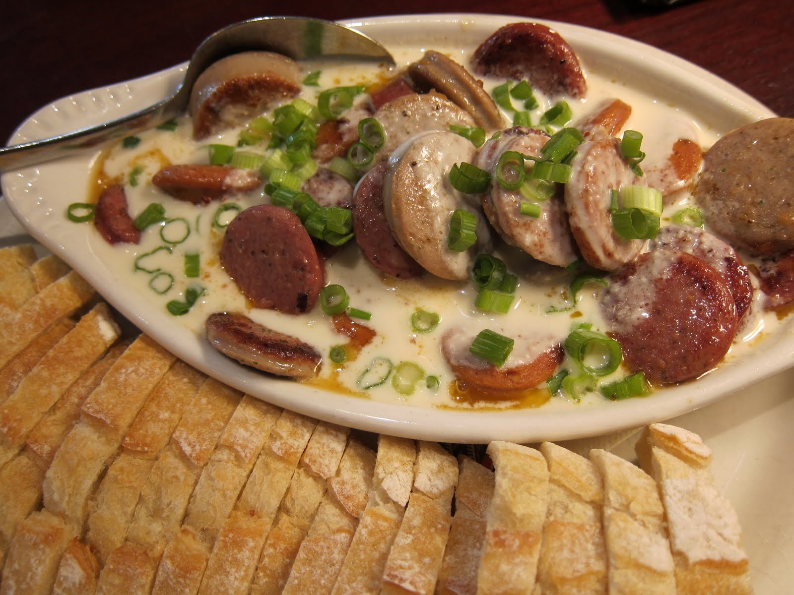 Banana Wonder Sausages + Fondue + Beer = 5 Six ft women at a table