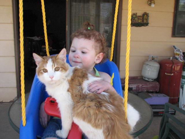 Kaydence and Samantha swinging.