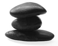 stock photography of smooth spa rocks on white background