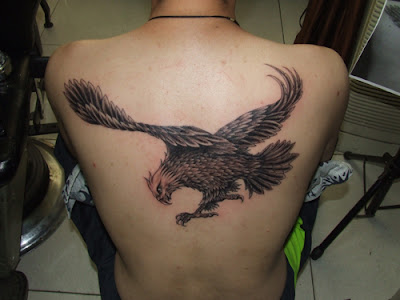 Flying eagle tattoo on the back