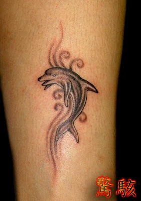 dolphin tattoo on the leg
