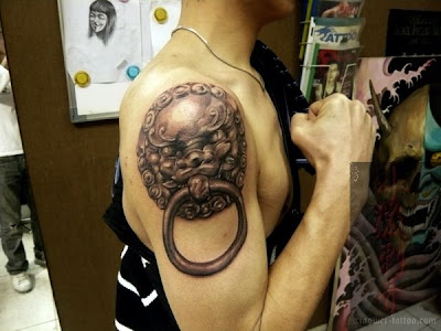  lion door knocker arm tattoo design,