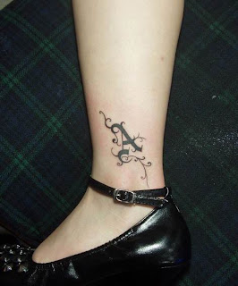 Single letter A tattoo on the ankle for girls