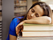 College student sleeping in library