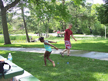 Traneice and Dad having a water fight, at Ahmad and Dodge's B-Day Party.