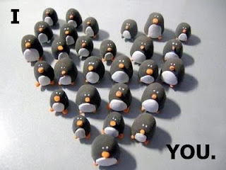 Penguins formed in heart shape