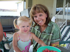 Grandma & Ashlynn playing outside, the kids were jumping on the tramp with the sprinkler under it.