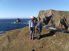 Raven and Ythan about to throw flowers in the sea for Katie