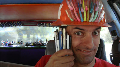 The Pen Guy and a bunch of donated pens inside the Mercedes Pens Art Car