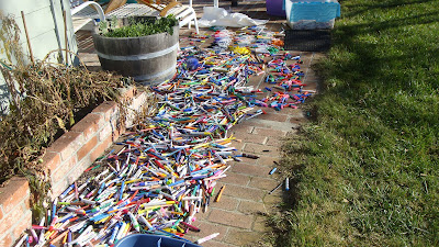 A ton of pens all over the sidewalk