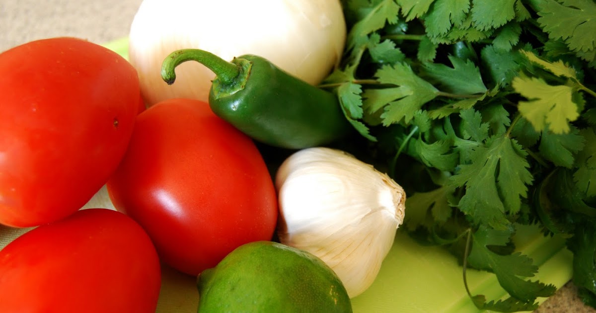 See Jane in the kitchen Pico De Gallo and chopping onions and tomatoes