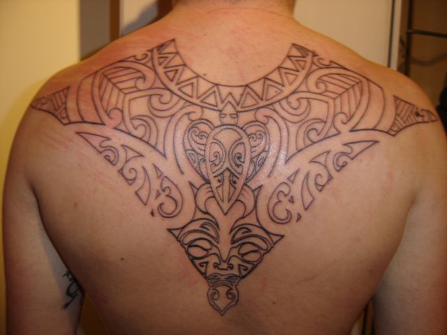 Polynesian style tattoos are